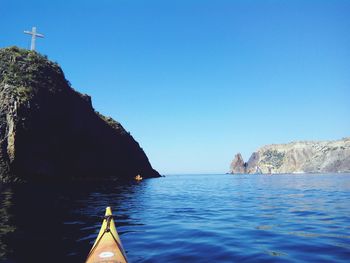 Scenic view of sea against clear blue sky