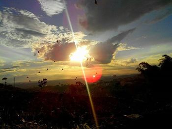 Scenic view of landscape against sky during sunset