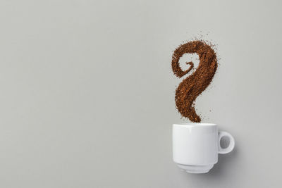 Close-up of coffee cup against white background