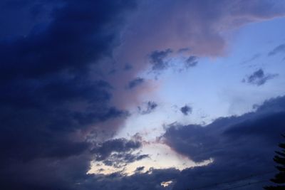 Low angle view of clouds in sky at sunset