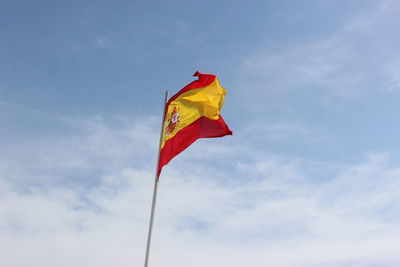 Low angle view of flag against sky