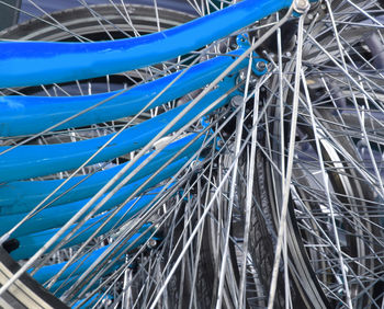 Low angle view of cables against blue sky