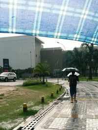 Woman walking on road