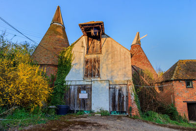 Exterior of old building against clear blue sky