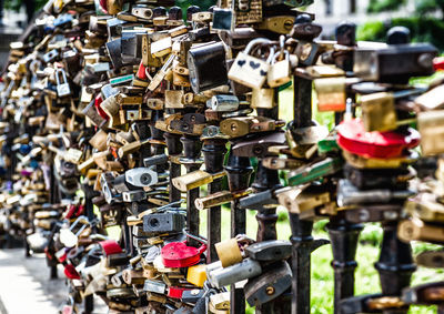 Close-up of padlocks hanging on railing