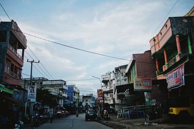 Street in city against sky