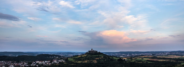 Panoramic view of buildings against sky at sunset