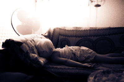 Young woman sleeping on bed
