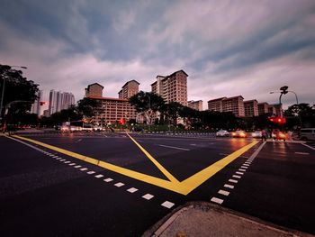 City street and buildings against sky