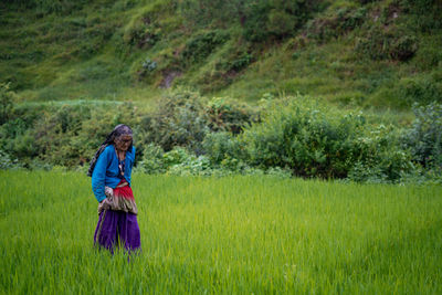 Full length of man standing in field