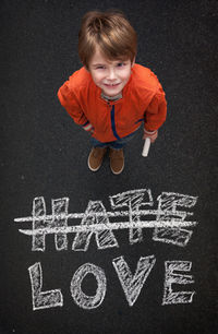 Portrait of boy with chalk