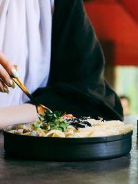 Close-up of person preparing food