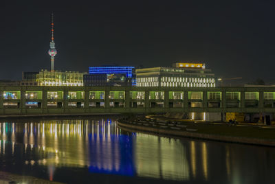 Illuminated buildings at waterfront