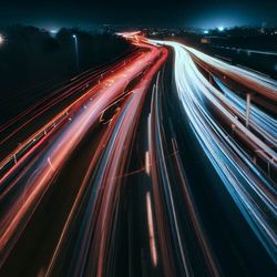 High angle view of light trails on road at night