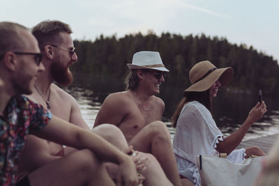 Friends relaxing at lake