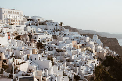 High angle view of buildings in city against clear sky. fira, santorini 