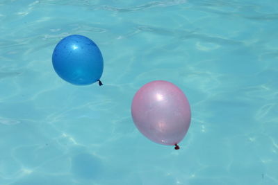 High angle view of balloons in swimming pool