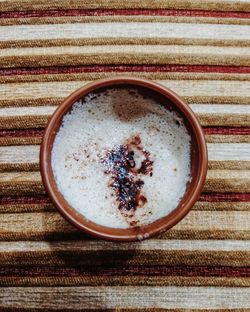 Directly above shot of coffee cup on table