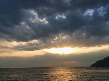 Scenic view of sea against cloudy sky