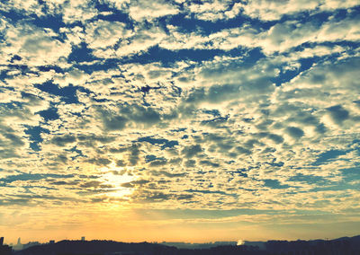 Low angle view of dramatic sky during sunset