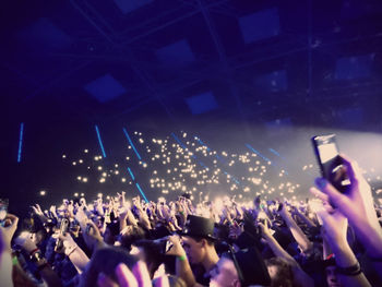 Rear view of people enjoying music concert