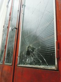 Close-up of broken glass window