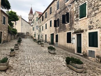 Footpath amidst buildings in town