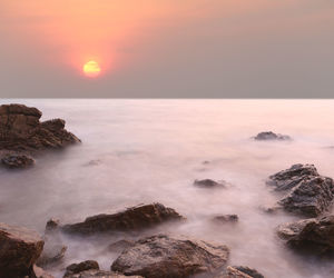 Scenic view of sea against sky during sunset