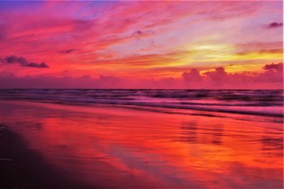Scenic view of sea against romantic sky at sunset