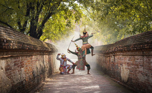 Dancers performing traditional dance on alley