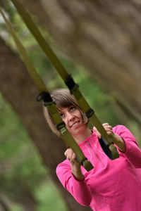 Mid adult woman exercising at park