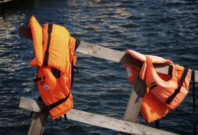 High angle view of  life vest on wooden post