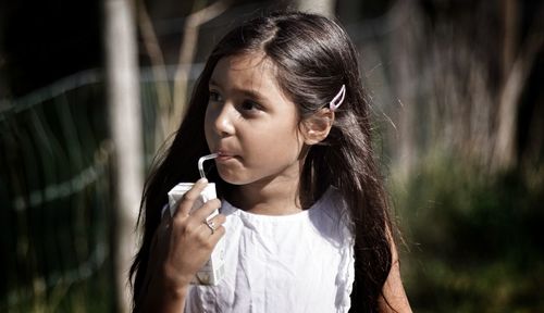 Close-up of girl standing outdoors