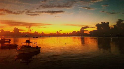 Scenic view of calm sea at sunset