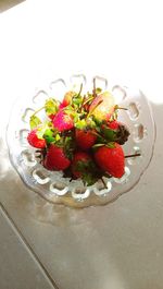 High angle view of strawberries in plate on table