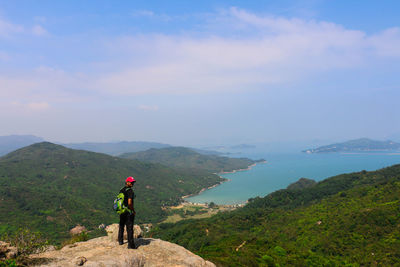 Woman looking at mountain landscape