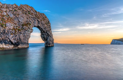 The durdle door at the jurassic coast in dorset after sunset