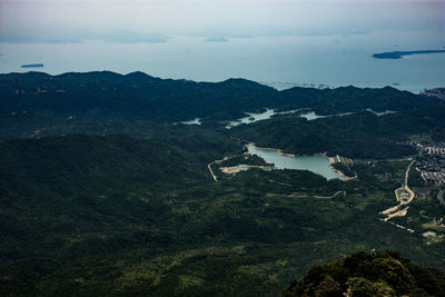 Scenic view of landscape and mountains against sky
