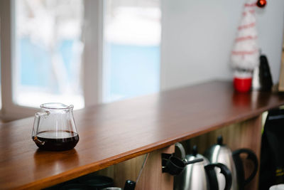 Close-up of wine glass on table at home