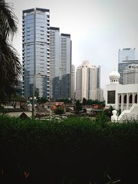 Modern buildings in city against sky