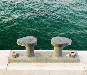 High angle view of bollard on pier