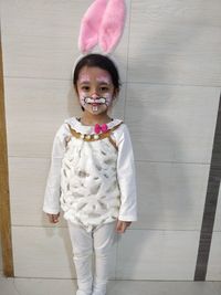 Portrait of smiling girl standing on floor