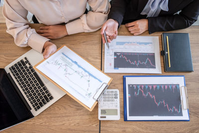 High angle view of business people working on table