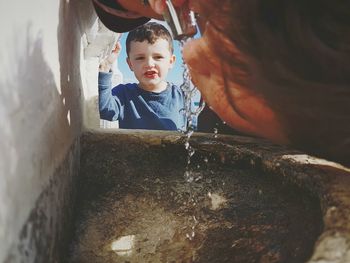 Close-up of boy standing in corridor