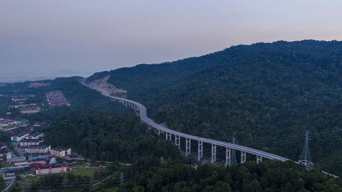 High angle view of road by mountain against sky