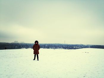 Full length of woman standing on shore