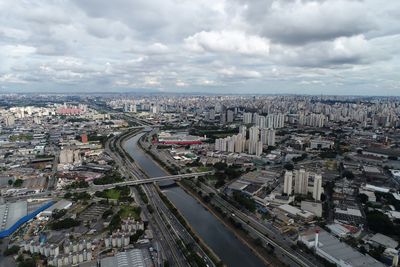 High angle view of city street and buildings against sky