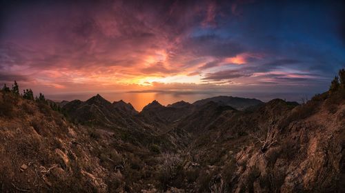 Scenic view of mountains against sky during sunset