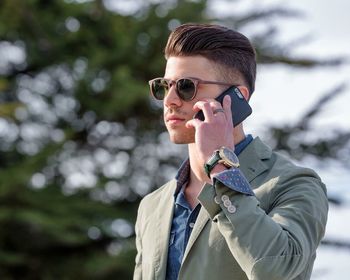 Portrait of young man standing outdoors