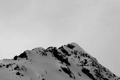 Scenic view of snow covered mountain against clear sky